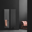 loft radiator placed on a red wall